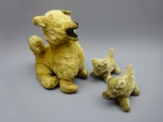 Plush covered seated dog with straw filled body and felt lined open mouth H28cm and two smaller