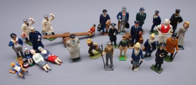 Twenty-five die-cast figures of town and village people and workmen including clergymen,