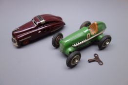 Two Schuco clockwork tin-plate cars - Schuco Fex 1111 in maroon with 'cranking handle' key L15cm