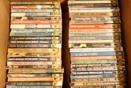 Forty-eight early James Bond paperback books published by Pan,