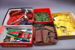 Collection of Meccano, various ages, including red, blue, yellow and green sections,