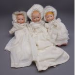 Three Armand Marseille 'My Dream Baby' bisque head dolls, each with moulded hair,