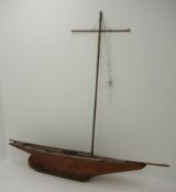 Early 20th century large pond yacht with planked wooden hull,