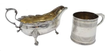 George III silver sauce boat by John Langlands I & John Robertson I, Newcastle and a silver mug,