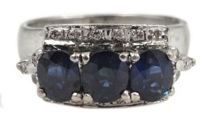 14ct white gold (tested) three stone oval sapphire and round brilliant cut diamond ring