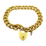 Early 20th century gold curb link bracelet with heart locket, stamped 9ct, approx 15.