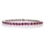 14ct white gold (tested) forty-four round ruby line bracelet Condition Report 12gm,