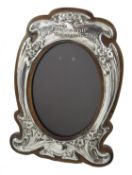 Art Nouveau silver on oak photograph frame embossed flower decoration,