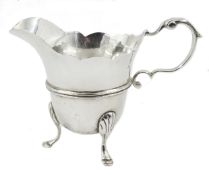 Victorian Irish silver cream jug, helmet shaped, waved top and scroll handle by John Smith,