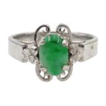 White gold cabochon oval jade and four stone diamond ring,
