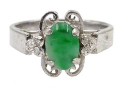 White gold cabochon oval jade and four stone diamond ring,