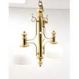 Edwardian style brass two branch light fitting with domed opaque glass shades,