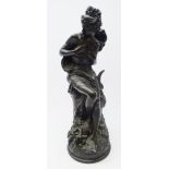 Victorian style bronzed resin model of a lady holding doves after A.