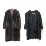 Three quarter length black fur coat retailed by Thompson's and a three quarter length faux fur coat