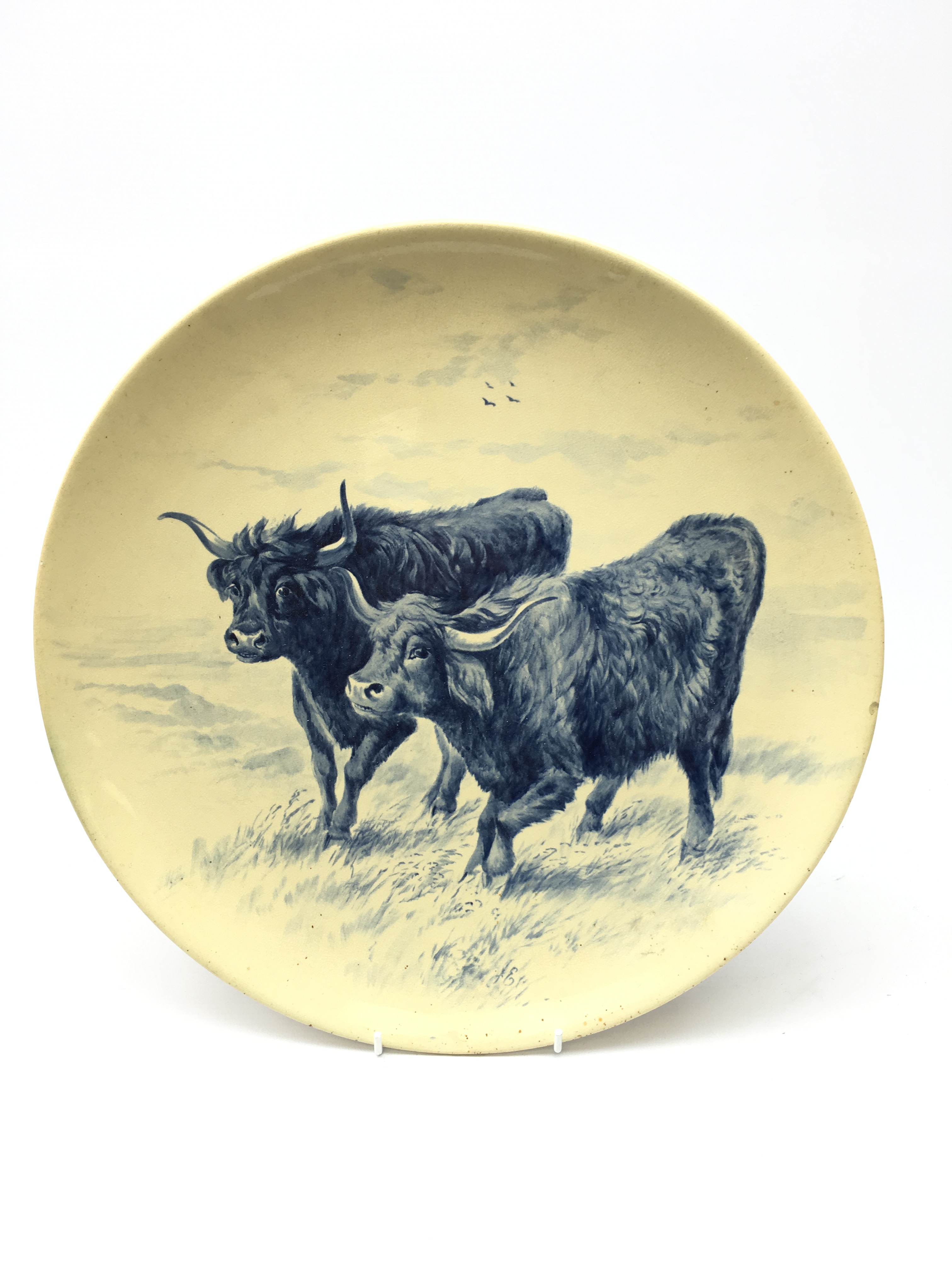 Victorian Mintons wall charger painted in underglaze blue with Cows in a field, signed J.