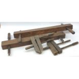 Four vintage fruit wood carpenters clamps, with wooden screw thread,