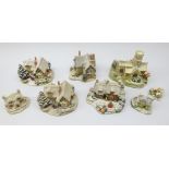 Eight Lilliput Lane Winter Collection cottages,