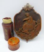 Chinese bamboo fortune sticks in cylindrical leather case and Chinese red lacquer shaped plaque