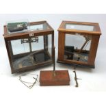 Set of Oertling chemical balance scales in mahogany case with a set of metric weights,