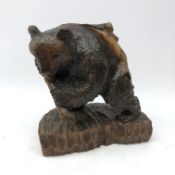 Black Forest style carved model of a Bear holding a fishing rod with catch,
