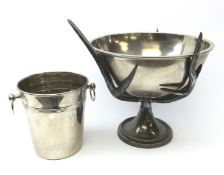 Large stainless steel punch bowl on antler moulded support,