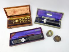 Two boxed Opthalmascopes,