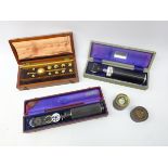 Two boxed Opthalmascopes,