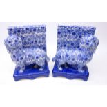 Pair Staffordshire type blue and white dog bookends,