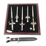 German enamel SS badge, reproduction Nazi dagger and miniature sword display board,