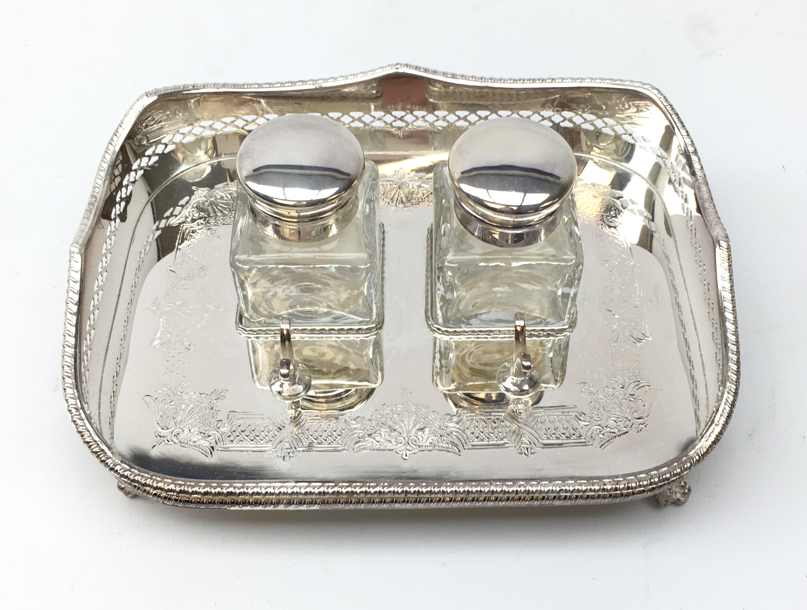 Ex-retail: Silver-plated desk stand comprising twin glass inkwells and pan stand within pierced