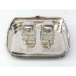 Ex-retail: Silver-plated desk stand comprising twin glass inkwells and pan stand within pierced