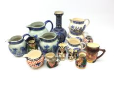 Set of three Arthur Wood graduated Old Willow pattern jugs, a similar set of jugs,