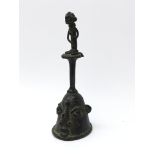 Nigerian Yoruba cast bronze bell with figural handle and mask shaped bell, H17.