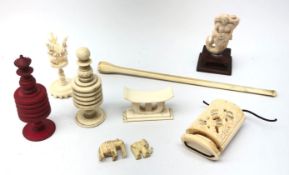Two 19th century turned bone chess pieces, early 20th century ivory pipe,