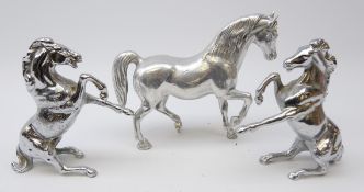 Pair silvered cast metal rearing Horses and matching horse,