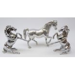 Pair silvered cast metal rearing Horses and matching horse,