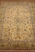 Persian Kashan rug carpet, ivory ground with central medallion, trailing foliage, repeating border,