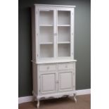 French style painted bookcase on cupboard, projecting cornice,