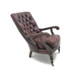 Chesterfield style library armchair, upholstered in deep buttoned ox blood leather, turned supports,