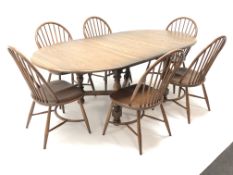 Ercol Golden Dawn finish elm extending oval dining table,