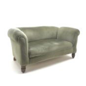 Early 20th century two seat drop arm sofa, upholstered in a light green fabric, turned supports,