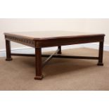 Square mahogany coffee table on fluted supports joined by a stretcher, W102cm, H42cm,