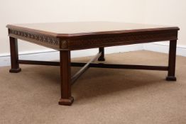 Square mahogany coffee table on fluted supports joined by a stretcher, W102cm, H42cm,