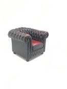 Chesterfield armchair upholstered in deep buttoned oxblood leather,