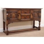 Jacobean style oak sideboard, two carved panel doors flanking two drawers,