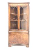 Reprodux Bevan Funnell mahogany concave corner display cabinet, projecting cornice, dentil frieze,