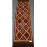 Meshwani brown grown runner, geometric patterned field,