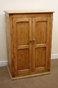 19th century pine two door cupboard, two panelled doors enclosing shelves, W85cm, H124cm,