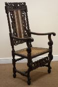 Carolean style oak chair, heavily carved back depicting mermaids, cane work splat and seat,