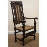 Carolean style oak chair, heavily carved back depicting mermaids, cane work splat and seat,